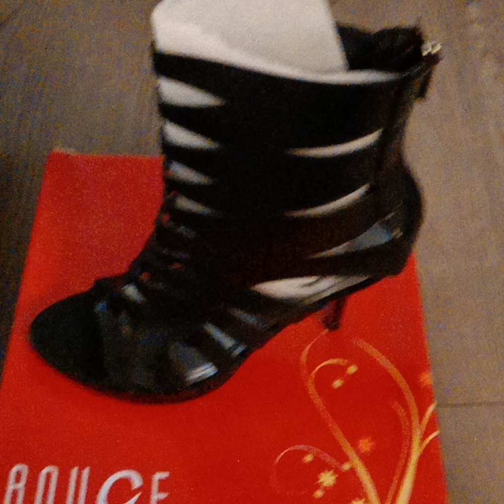 Black high heel shoes with the splits zip up in the back
